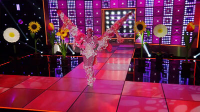 RuPauls Drag Race Season 16 Episode 07 - The Sound of Rusic - I Could Buy Myself Flowers Runway Q wide-shot